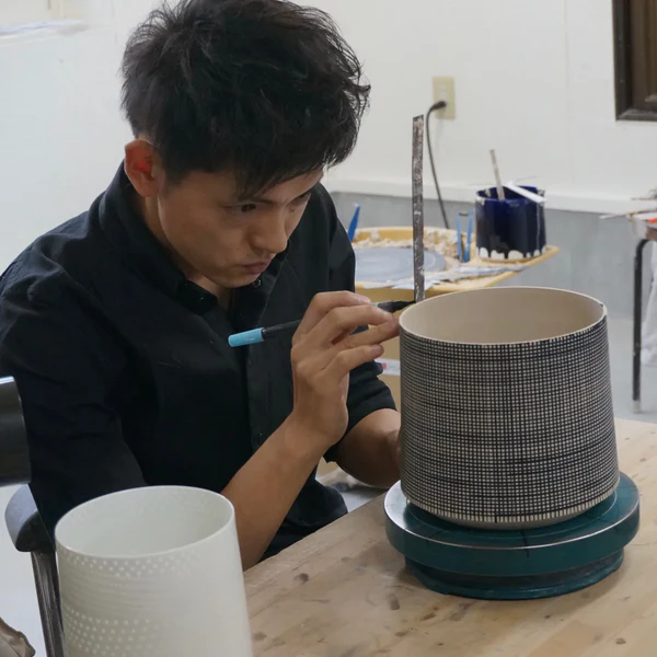 Niisato Akio 新里 明士